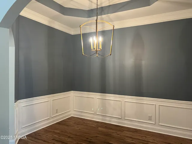 a view of a livingroom with wooden floor