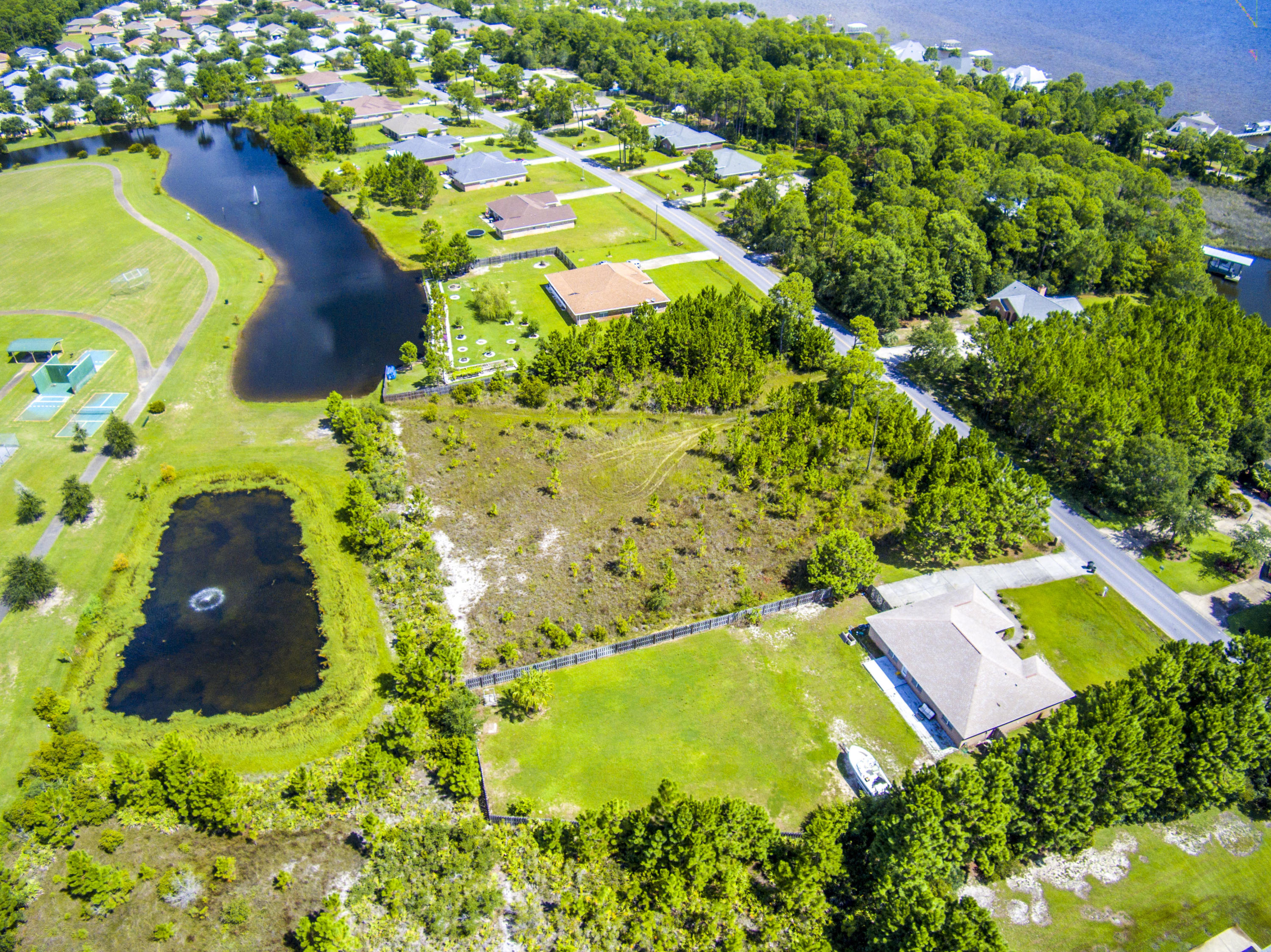 Lot 3 East Shipwreck Road Santa Rosa Beach, FL 32459 - Photo 11 of 26 an aerial view of residential house with swimming pool and garden