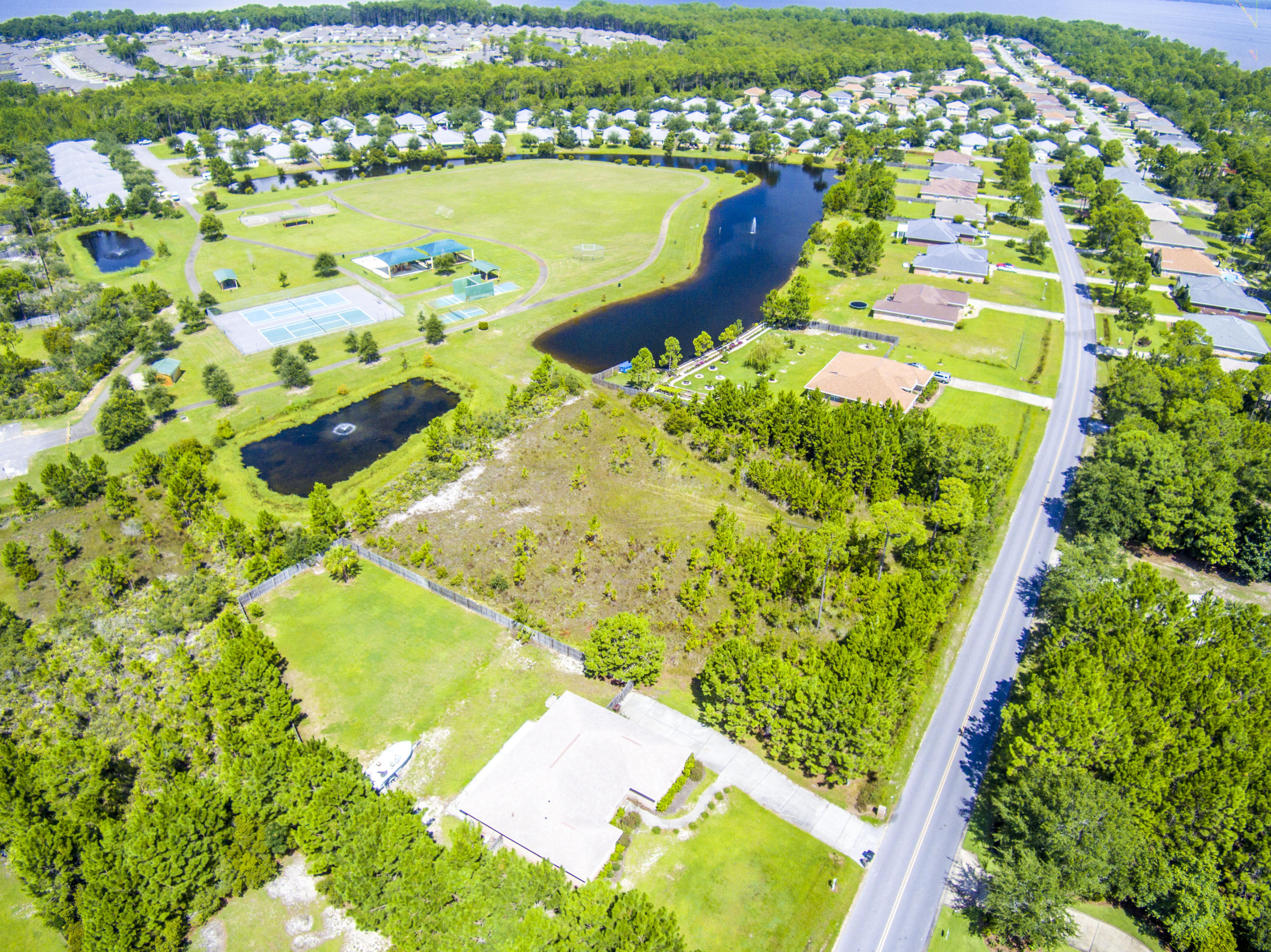 Lot 3 East Shipwreck Road Santa Rosa Beach, FL 32459 - Photo 13 of 26 a view of a swimming pool from a lake view