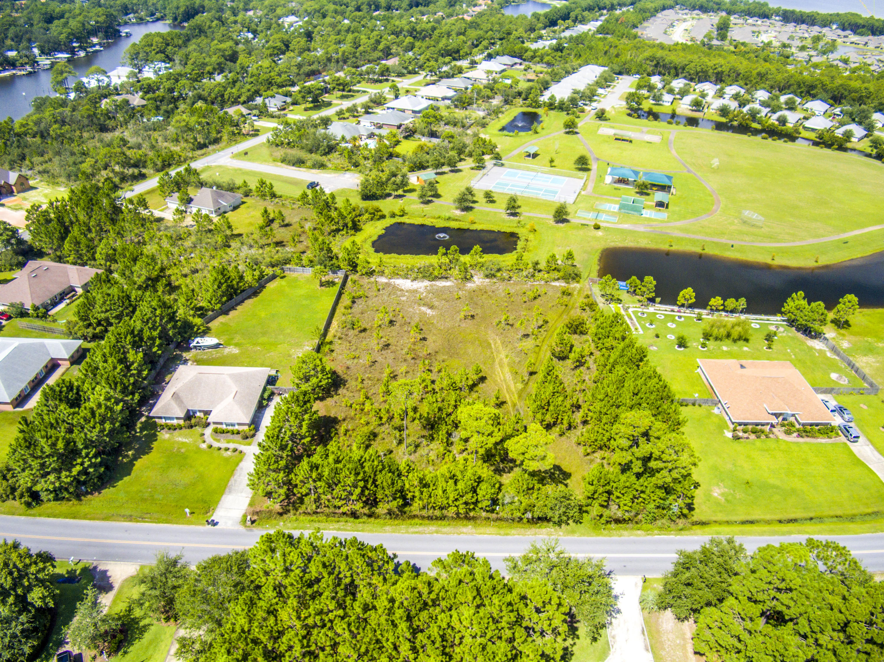Lot 3 East Shipwreck Road Santa Rosa Beach, FL 32459 - Photo 16 of 26 a view of an swimming pool with an outdoor space and seating area
