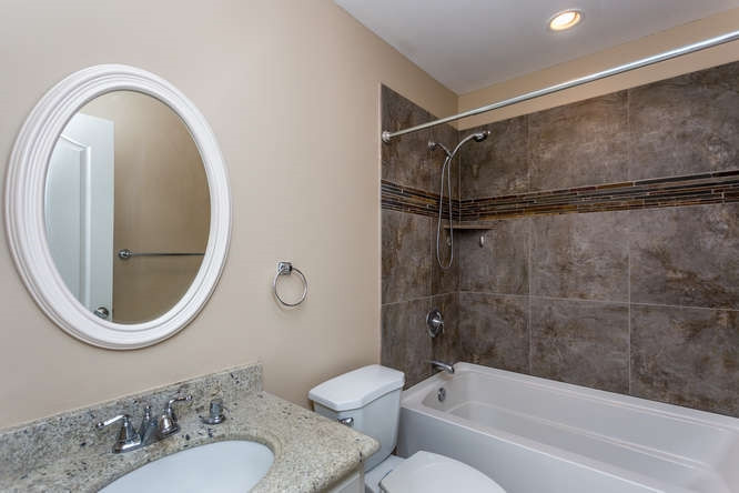 6916 Laurdane Road Raleigh, NC 27613 - Photo 16 of 23 Secondary bath with beautiful tile and granite! Bathroom