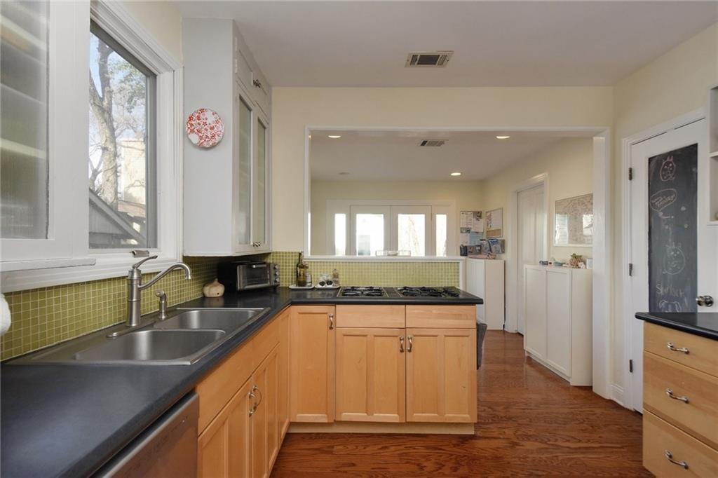 4412 Barrow Avenue, Unit B Austin, TX 78751 - Photo 10 of 28 a large kitchen with a sink and a large window