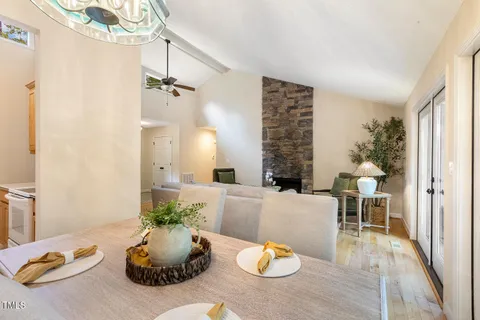 a kitchen with stainless steel appliances granite countertop a sink and a white cabinets