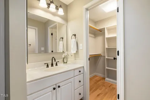 a white toilet sitting next to a small bathroom