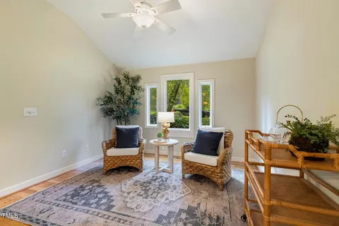 a kitchen with cabinets and a refrigerator