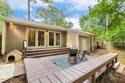 an aerial view of a house with a yard and lake view