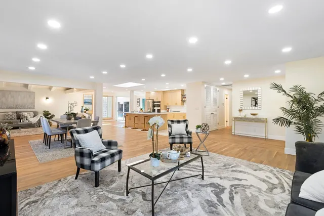 a living room with furniture kitchen view and a kitchen view