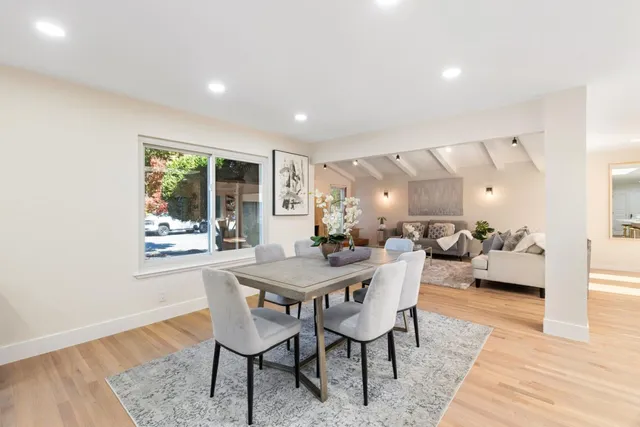 a dining room with furniture and window
