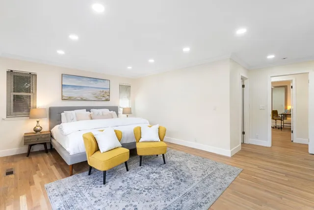 a bed room with a bed and a couch