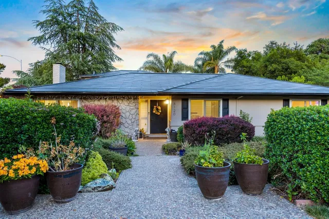 a view of a garden with a patio