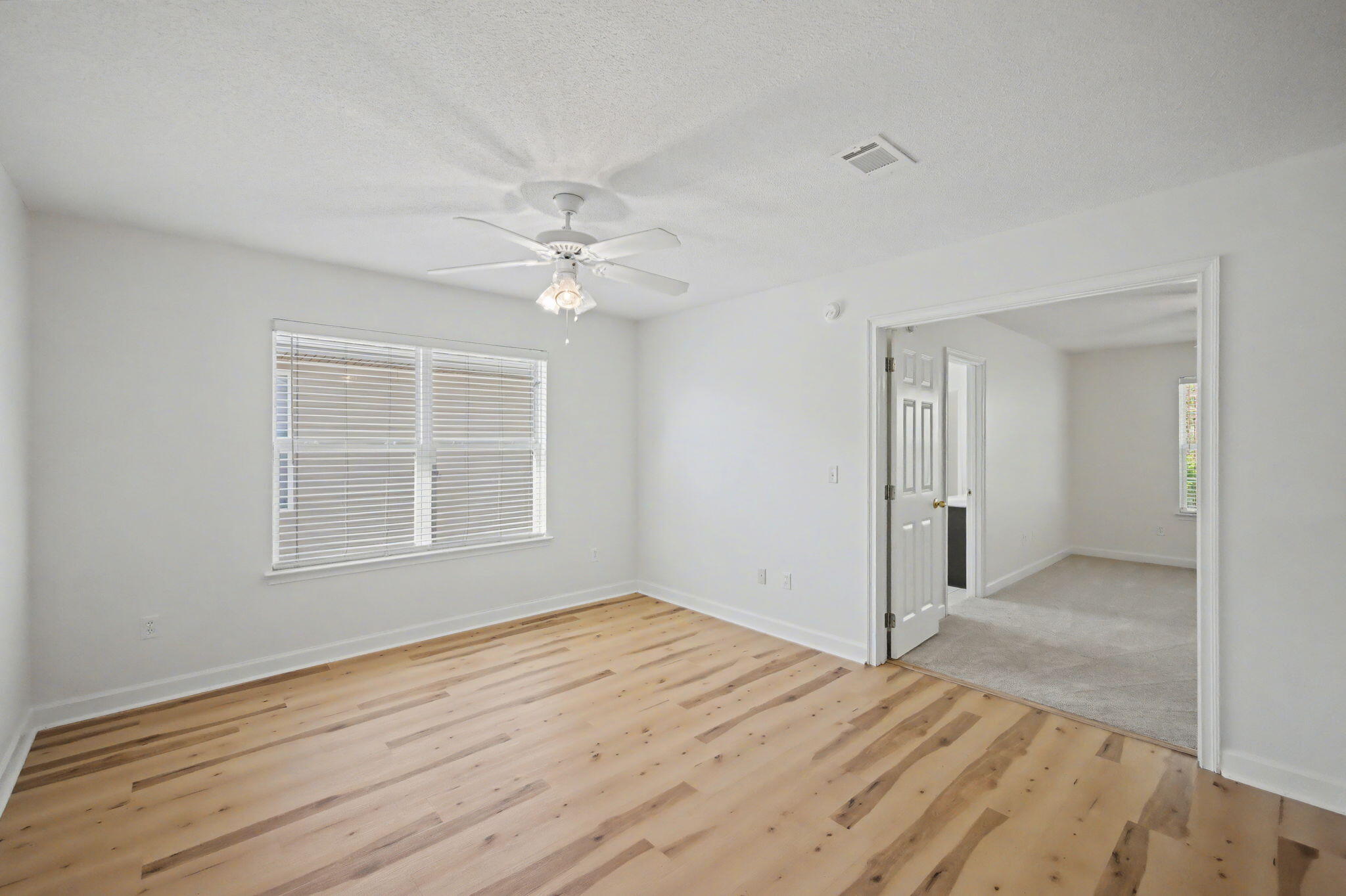 28 3rd Street Shalimar, FL 32579 - Photo 15 of 31 a view of empty room with wooden floor and fan