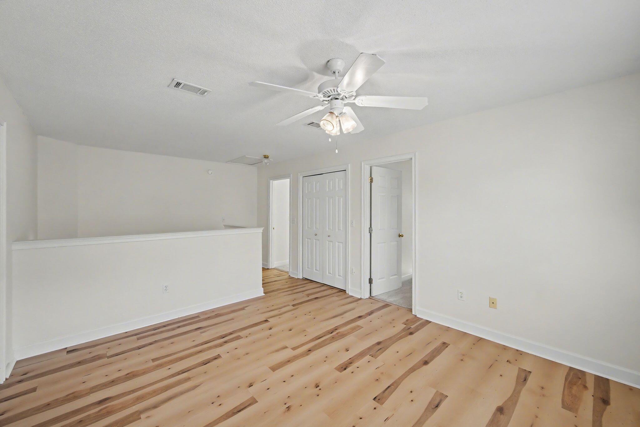 28 3rd Street Shalimar, FL 32579 - Photo 16 of 31 a view of empty room with wooden floor