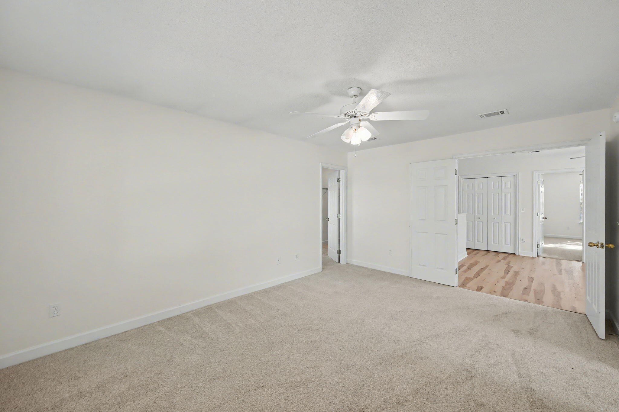 28 3rd Street Shalimar, FL 32579 - Photo 18 of 31 an empty room with a ceiling fan and a window