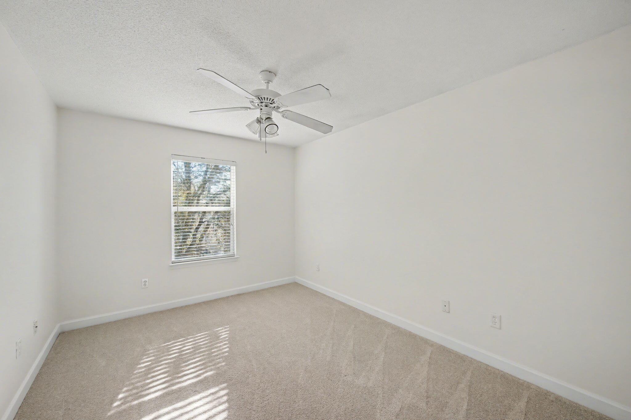 28 3rd Street Shalimar, FL 32579 - Photo 21 of 31 an empty room with a window