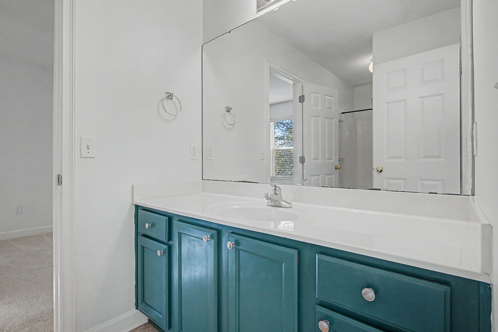 28 3rd Street Shalimar, FL 32579 - Photo 25 of 31 a bathroom with a sink and a mirror