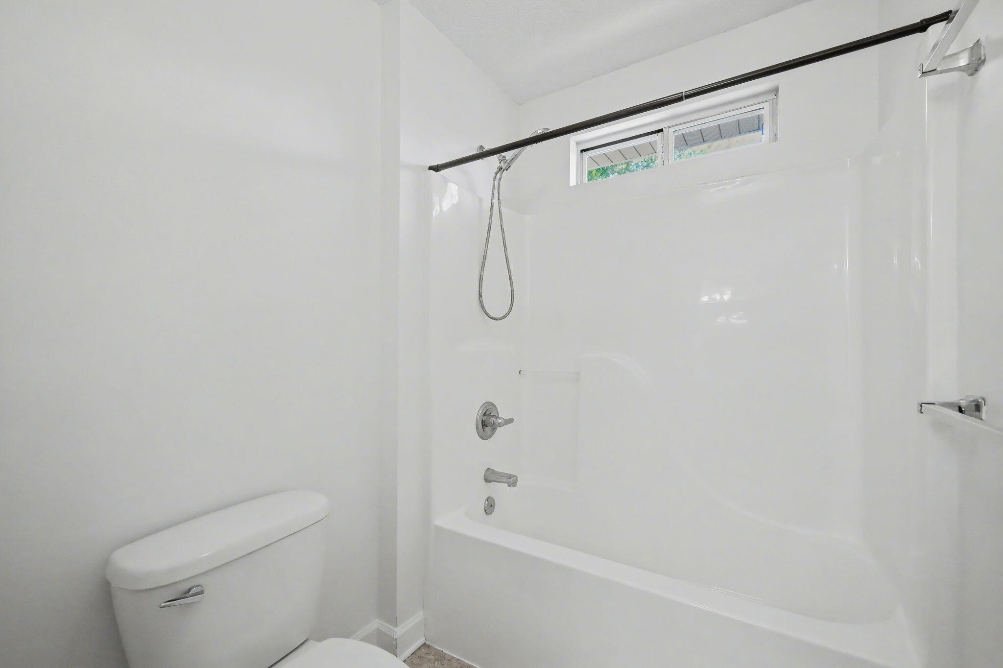 28 3rd Street Shalimar, FL 32579 - Photo 26 of 31 a bathroom with a shower and a toilet