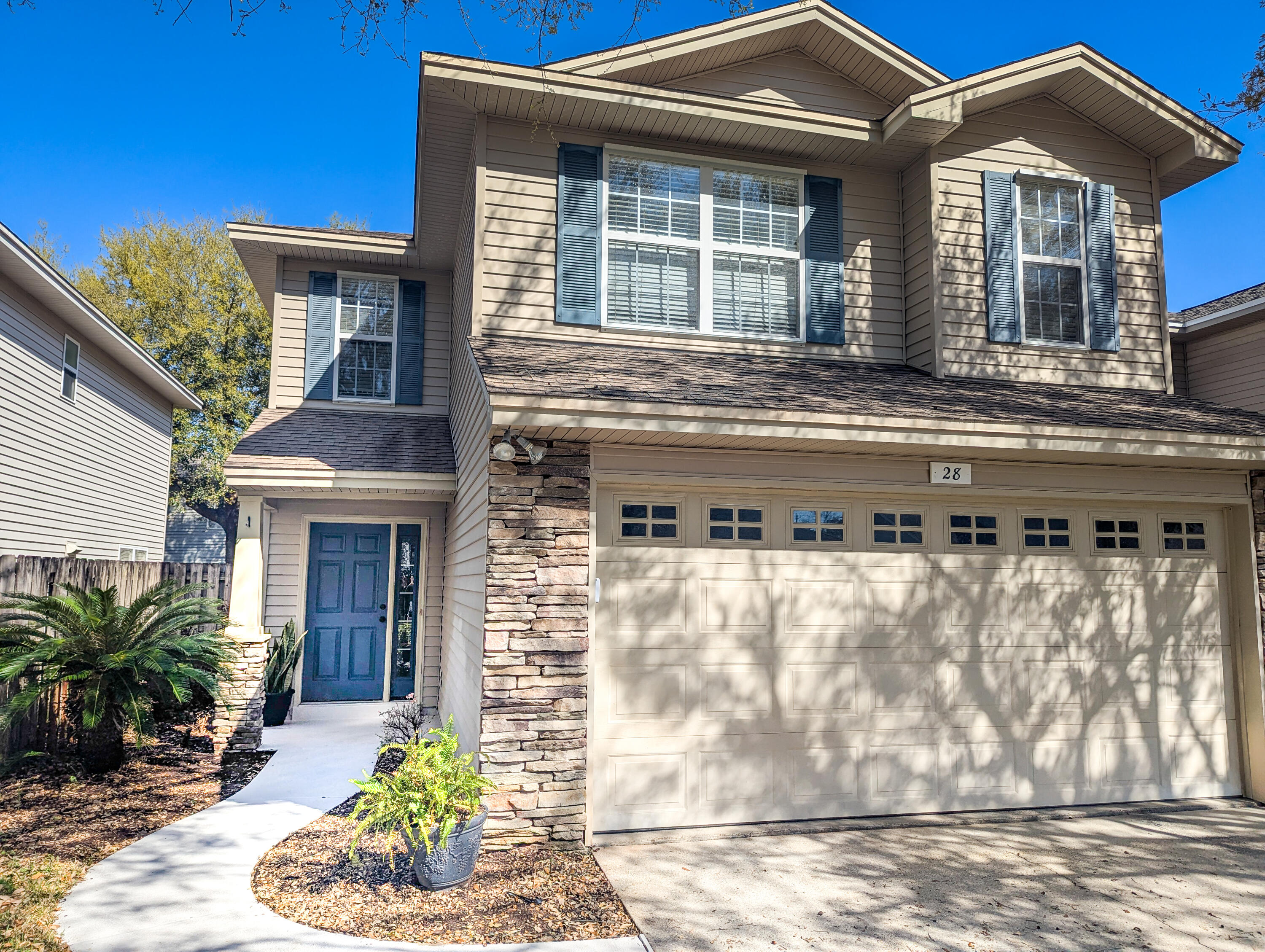 28 3rd Street Shalimar, FL 32579 - Photo 3 of 31 a front view of a house with a yard