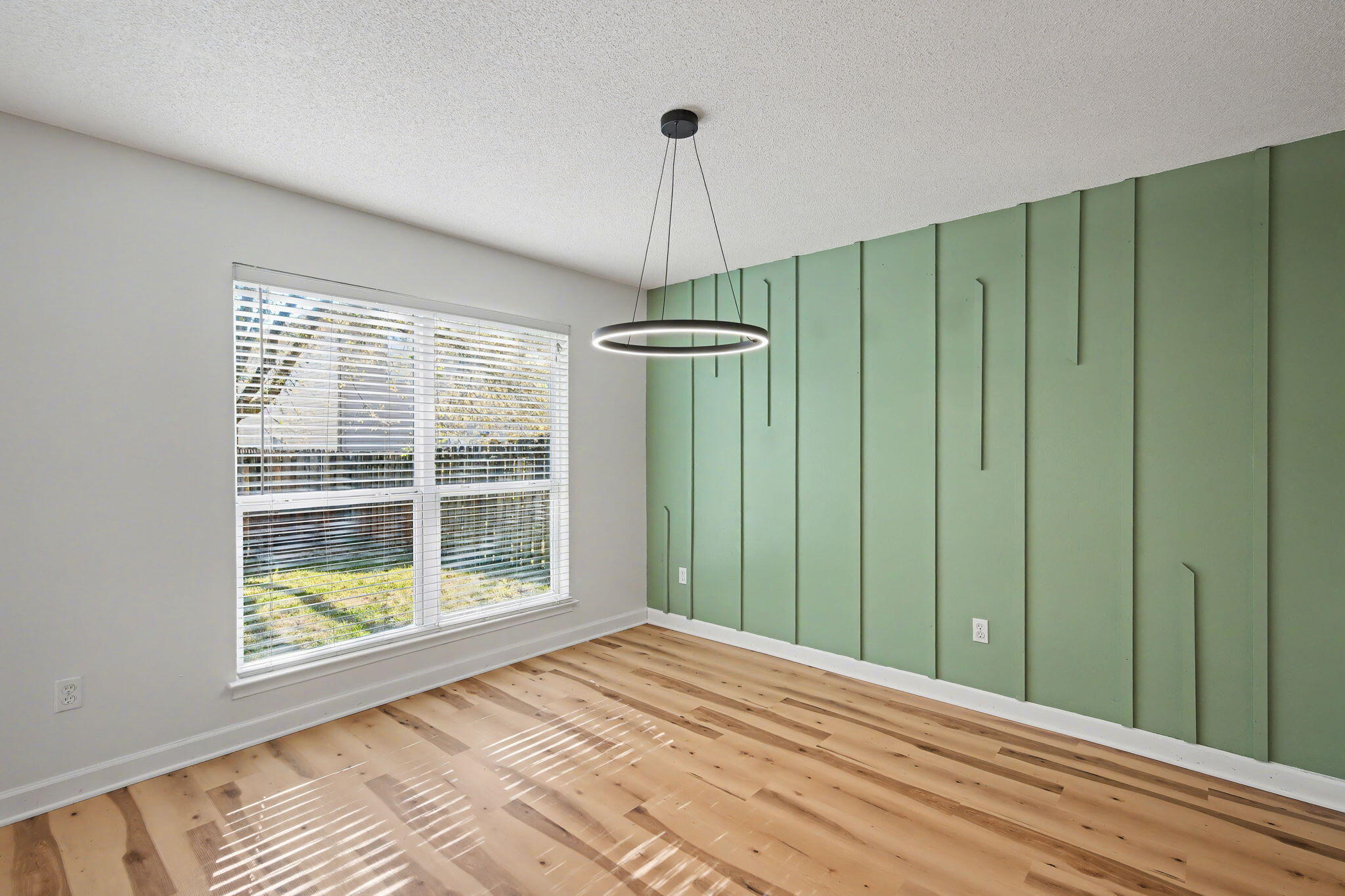 28 3rd Street Shalimar, FL 32579 - Photo 8 of 31 a view of a room that has a large window and wooden floor