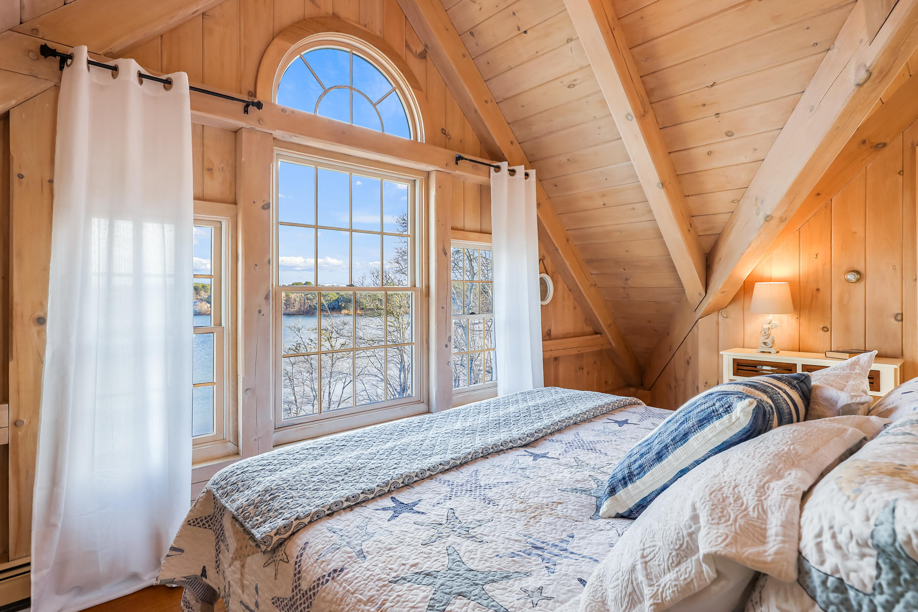 100 Lawton Road Eastham, MA 02642 - Photo 25 of 62 a bedroom with a bed and a window