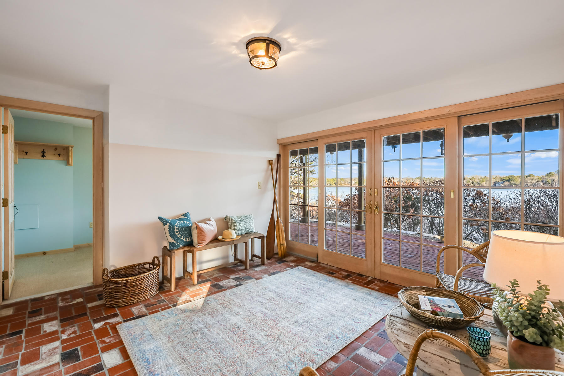 100 Lawton Road Eastham, MA 02642 - Photo 32 of 62 a living room with furniture and a floor to ceiling window