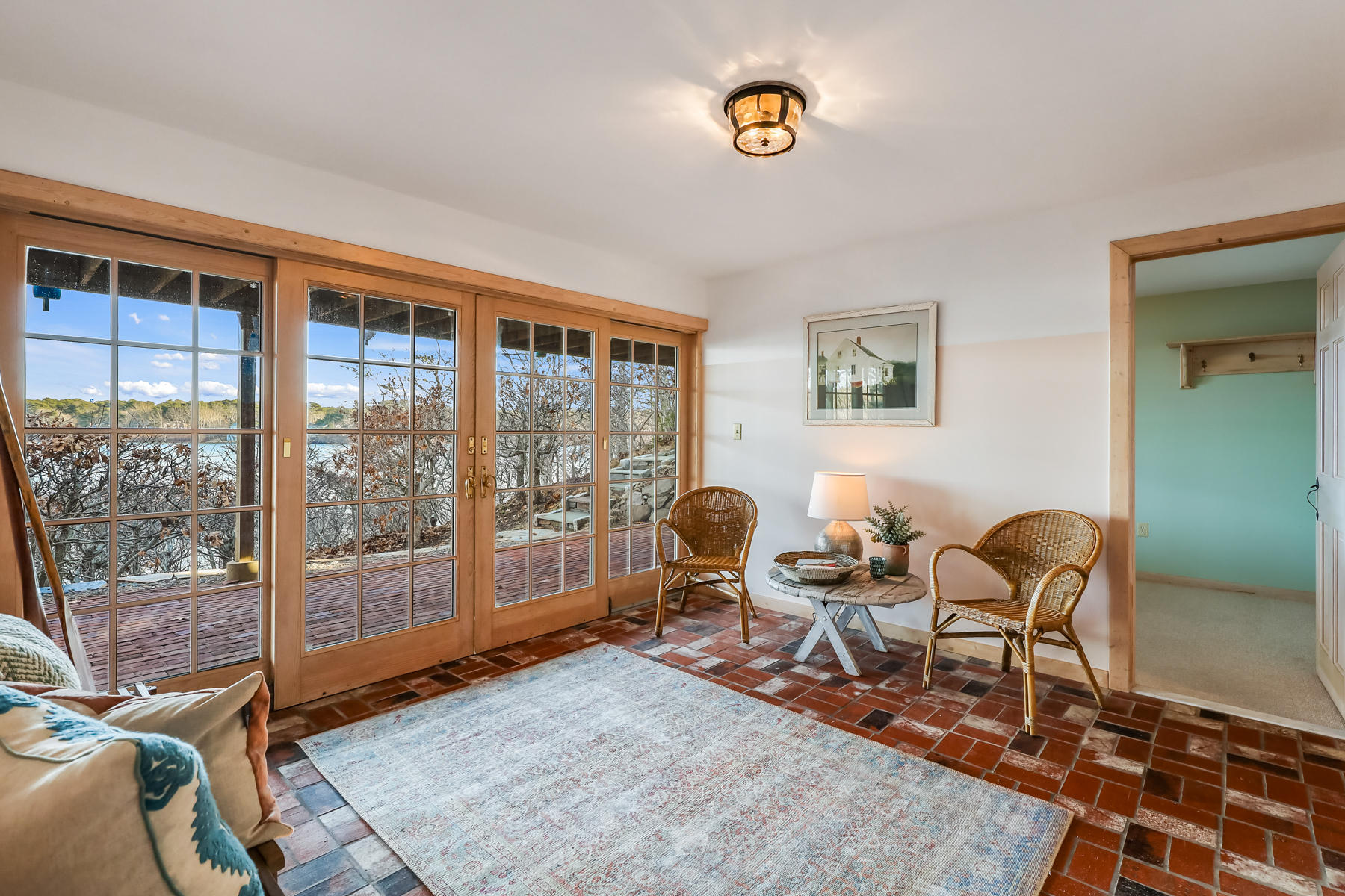 100 Lawton Road Eastham, MA 02642 - Photo 33 of 62 a living room with furniture and a floor to ceiling window