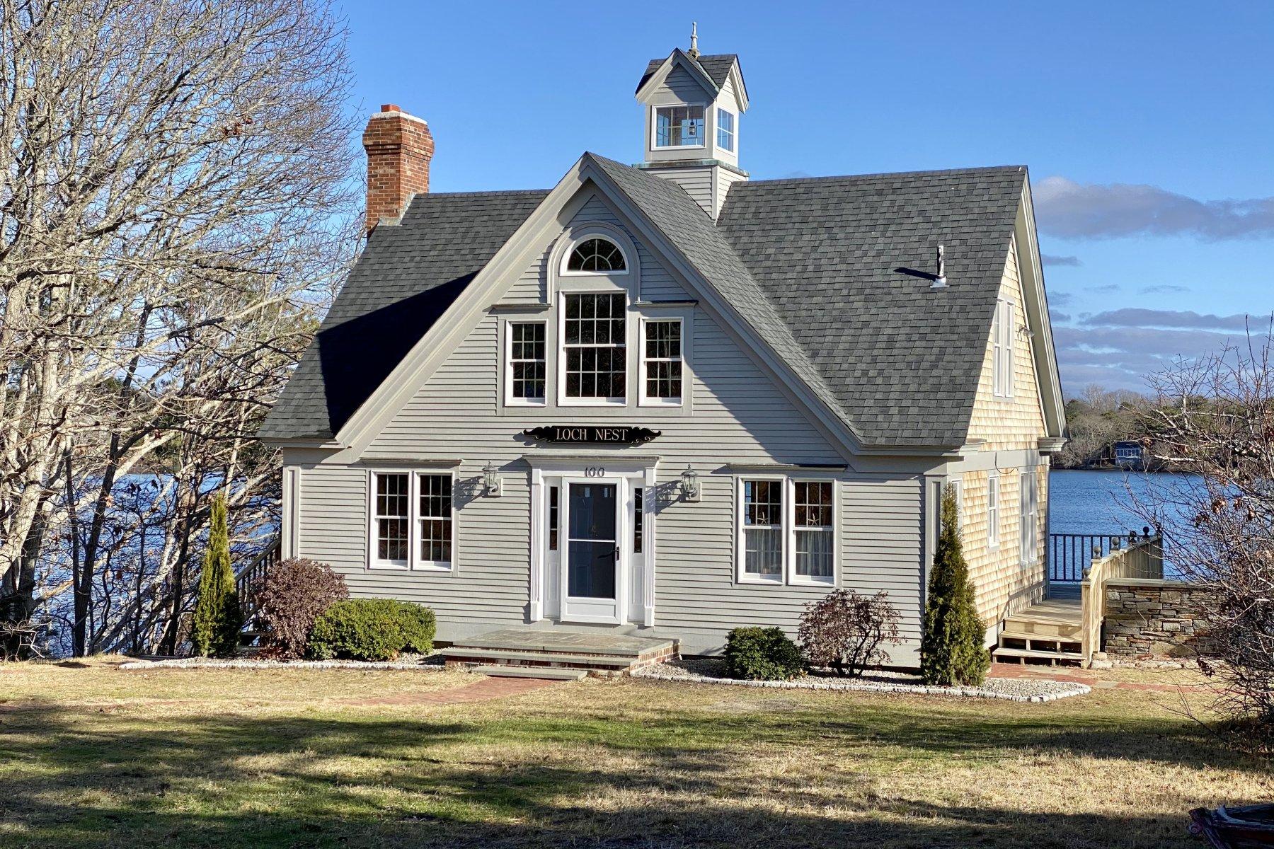 100 Lawton Road Eastham, MA 02642 - Photo 4 of 62 a front view of a house with a yard