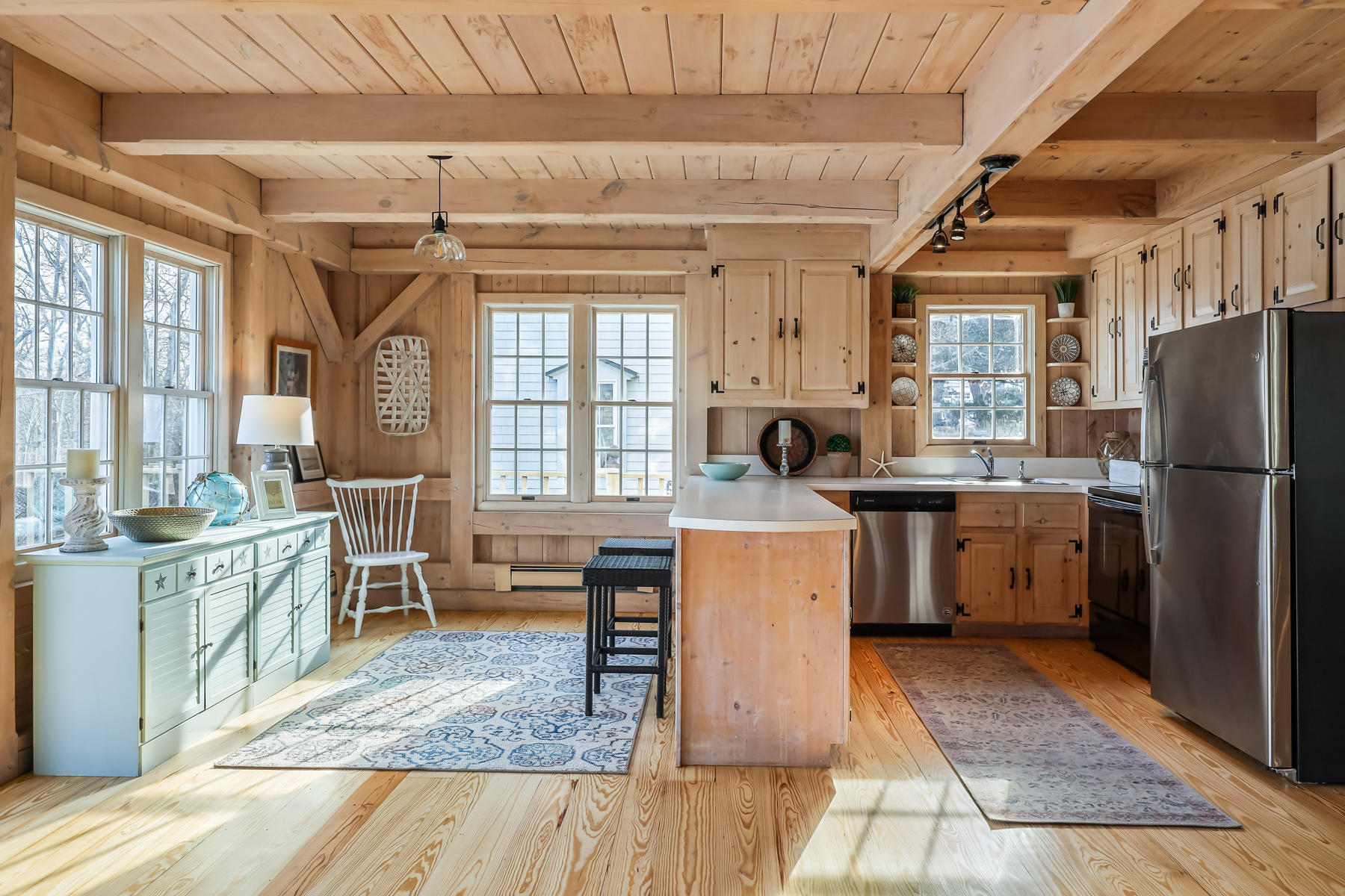 100 Lawton Road Eastham, MA 02642 - Photo 9 of 62 a kitchen that has a sink a stove a refrigerator and a dining table