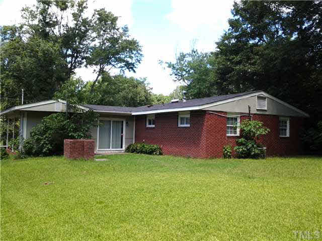 829 Friar Tuck Road Raleigh, NC 27610 - Photo 4 of 5 a view of a house with a yard and tree