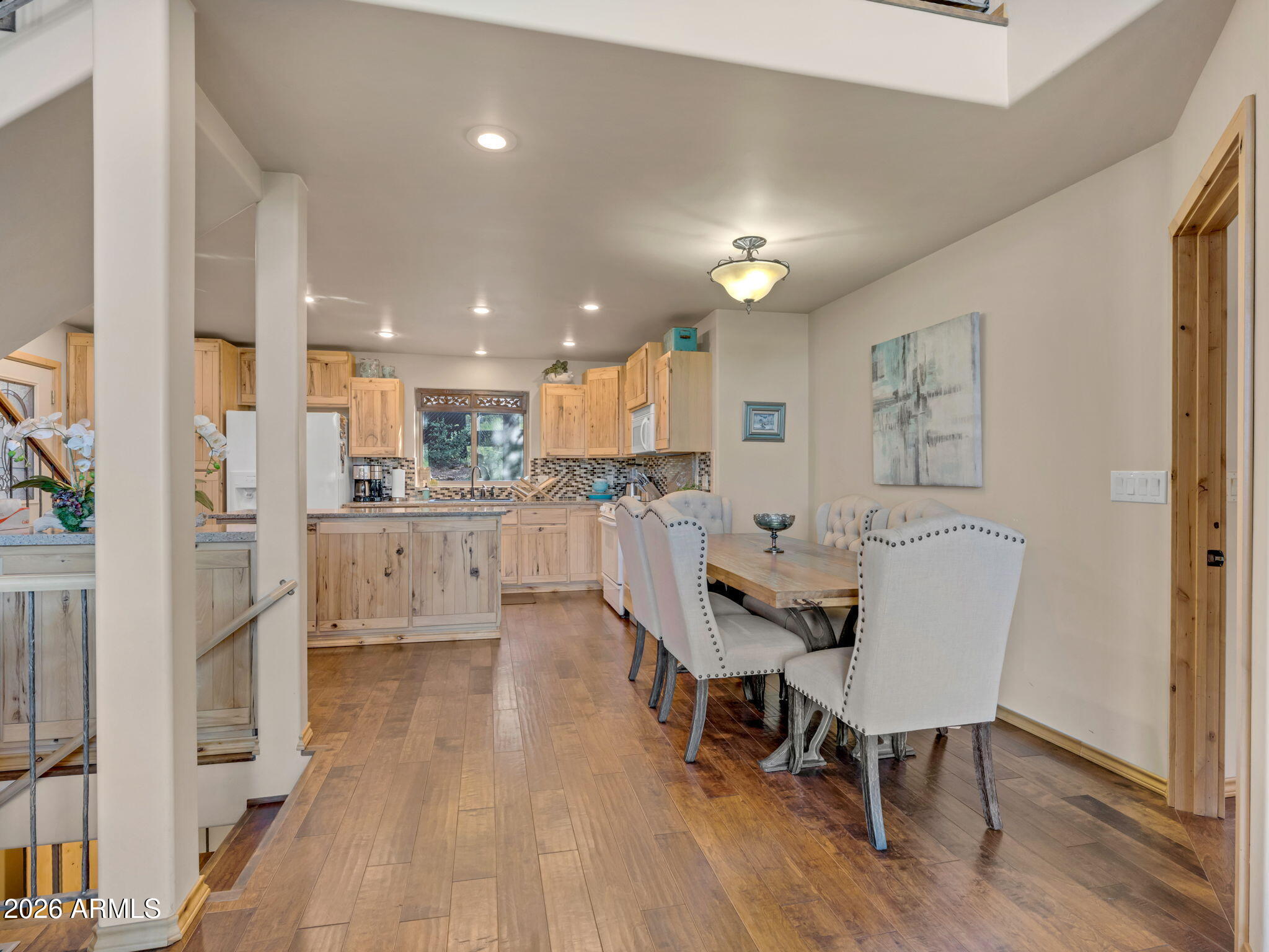 6829 Robbin Lane Pine, AZ 85544 - Photo 15 of 44 a view of a dining room with furniture and wooden floor
