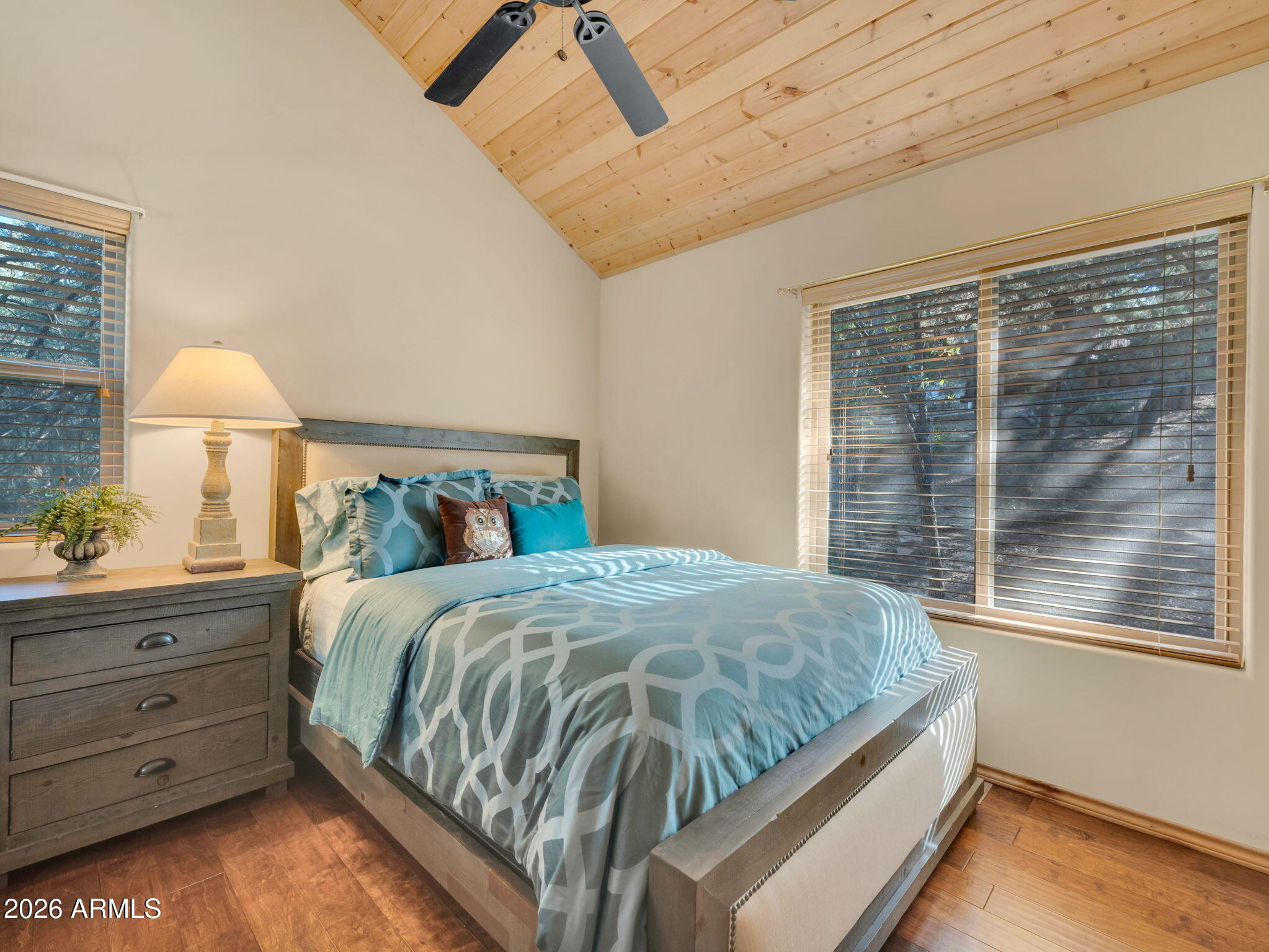 6829 Robbin Lane Pine, AZ 85544 - Photo 23 of 44 a bed sitting in a bedroom next to a window