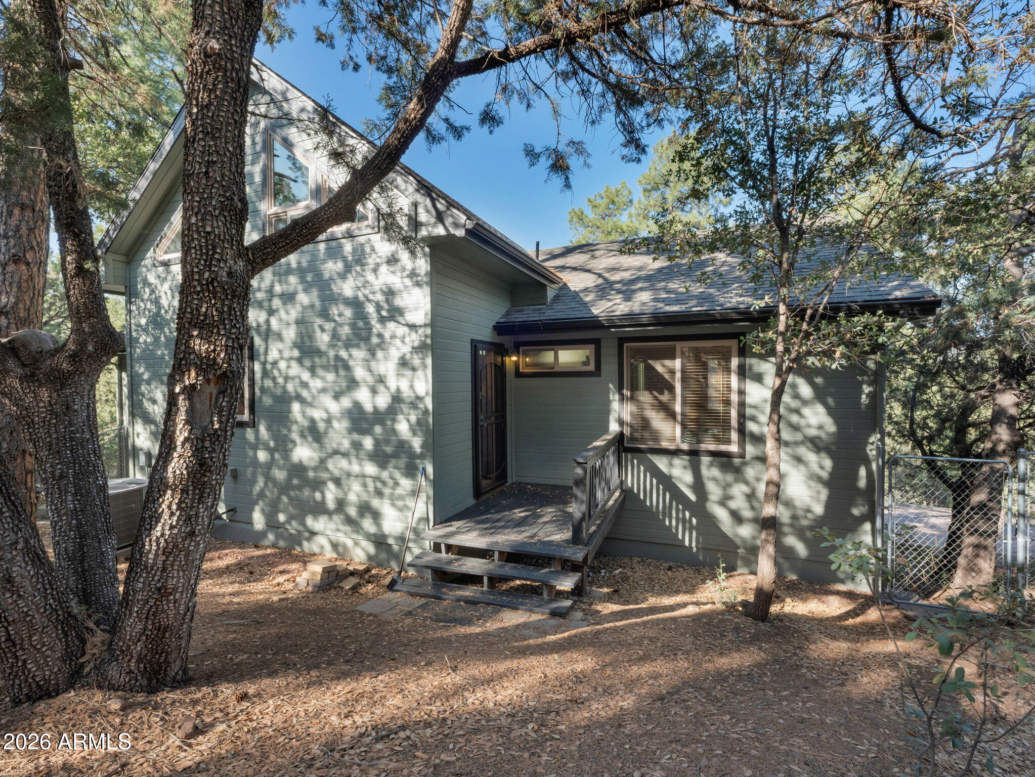 6829 Robbin Lane Pine, AZ 85544 - Photo 29 of 44 a front view of a house with a yard