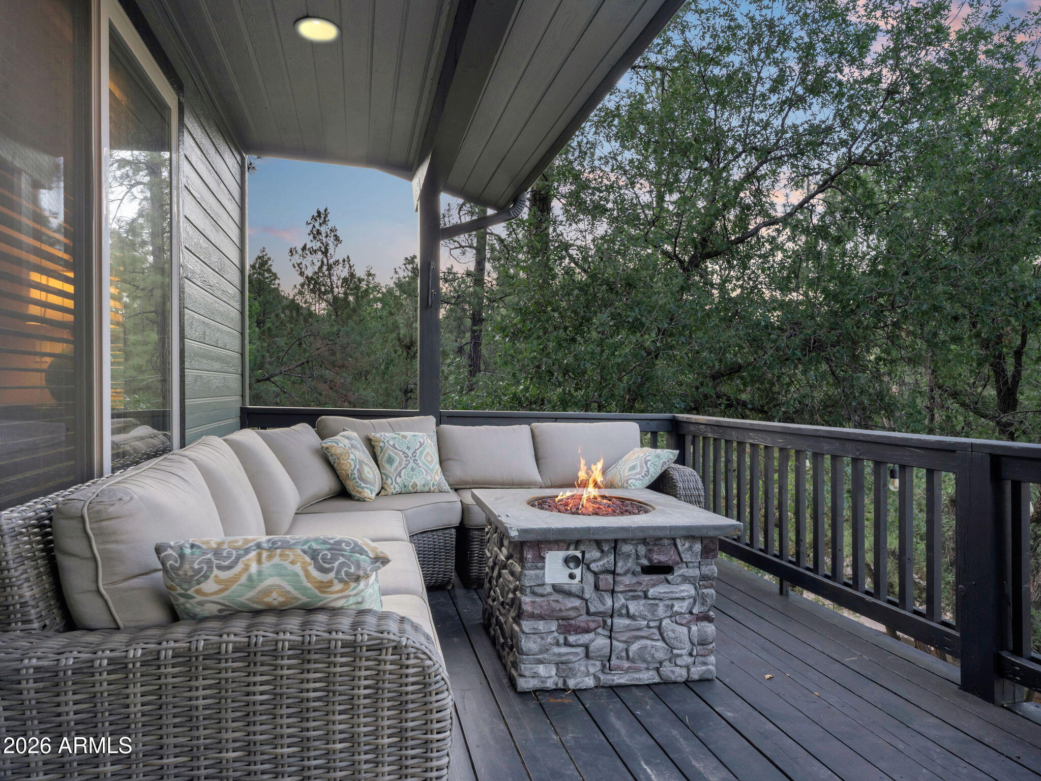 6829 Robbin Lane Pine, AZ 85544 - Photo 34 of 44 a balcony with wooden floor and outdoor seating