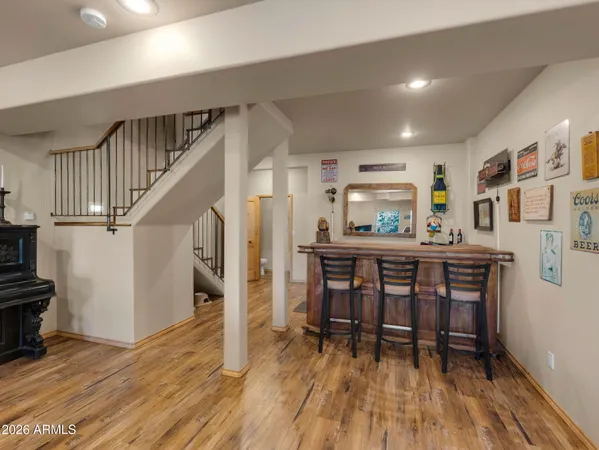 a dining room with furniture and wooden floor