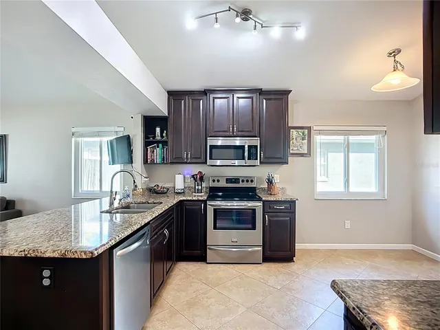 a bedroom with a bed and a ceiling fan