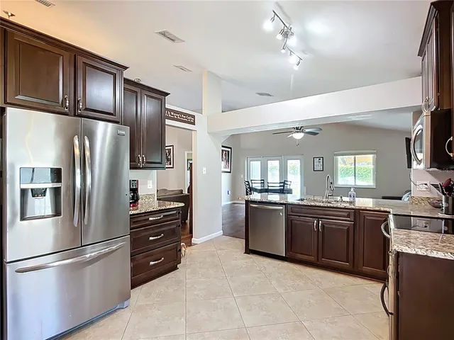a bedroom with a bed and glass window