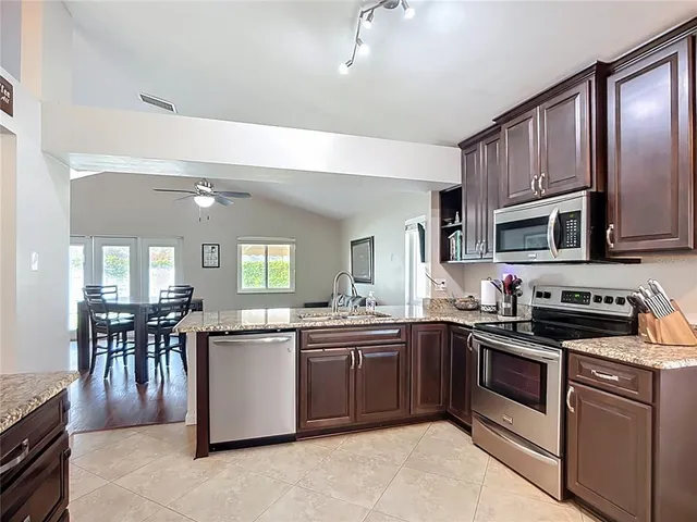 a bedroom with furniture and a large window