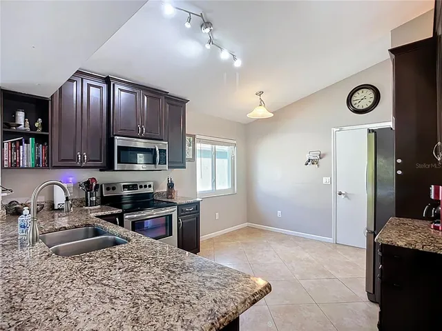 a view of a chairs and table in the patio