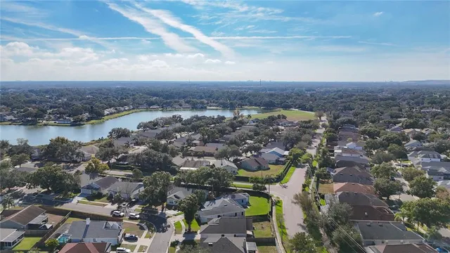 a living room with fireplace furniture and a wooden floor