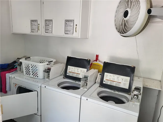 a kitchen with a stove and a white cabinet