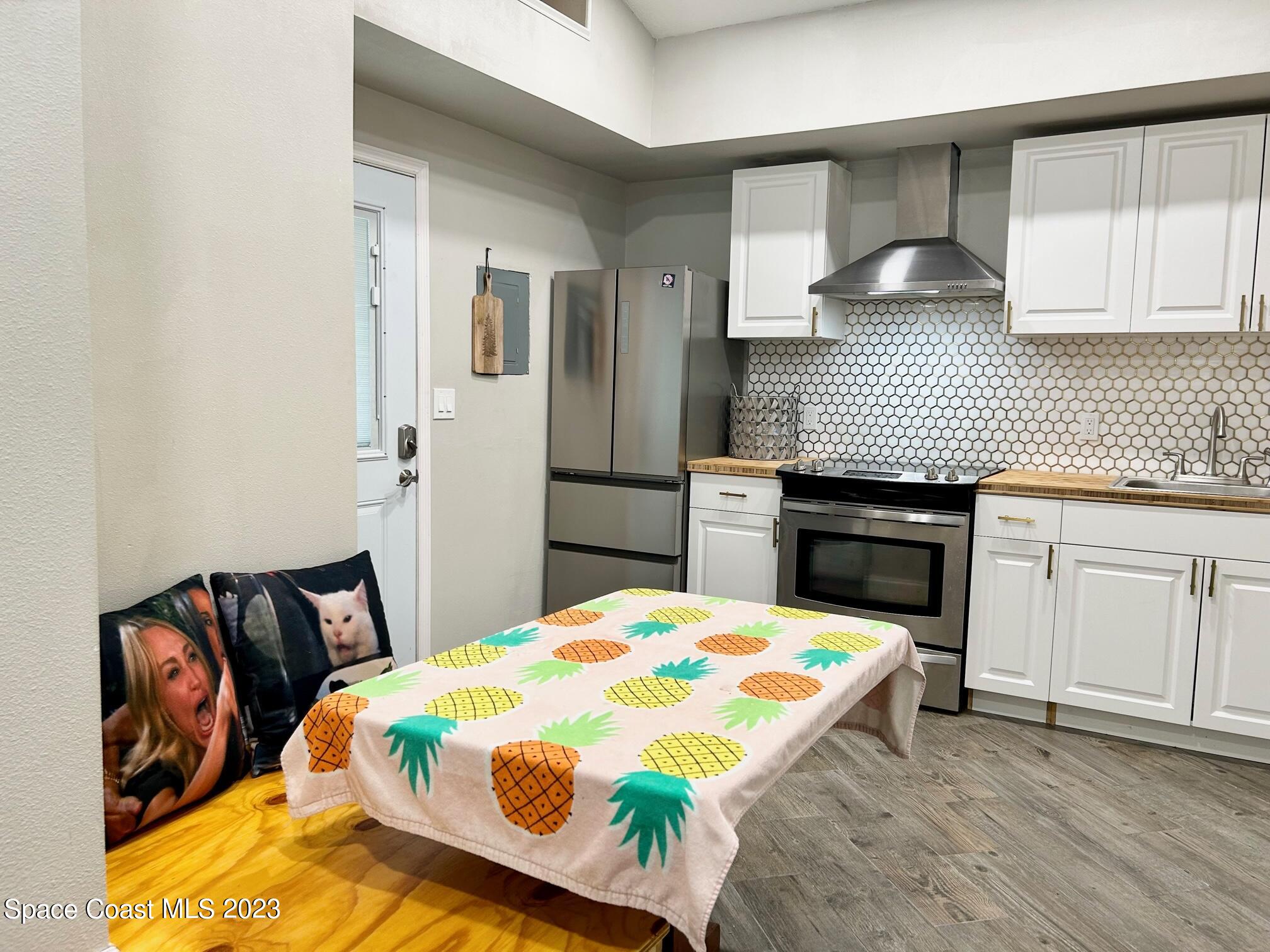 1639 Emmaus Road Northwest Palm Bay, FL 32907 - Photo 29 of 40 a kitchen that has a sink and a stove