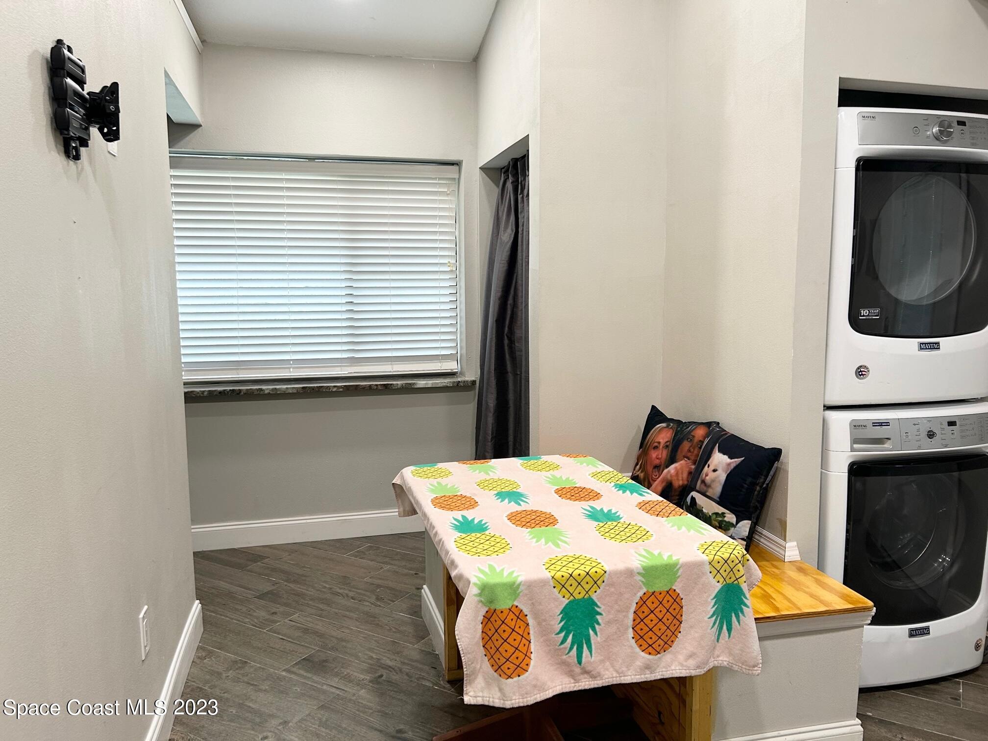 1639 Emmaus Road Northwest Palm Bay, FL 32907 - Photo 31 of 40 a bedroom with a bed and a window