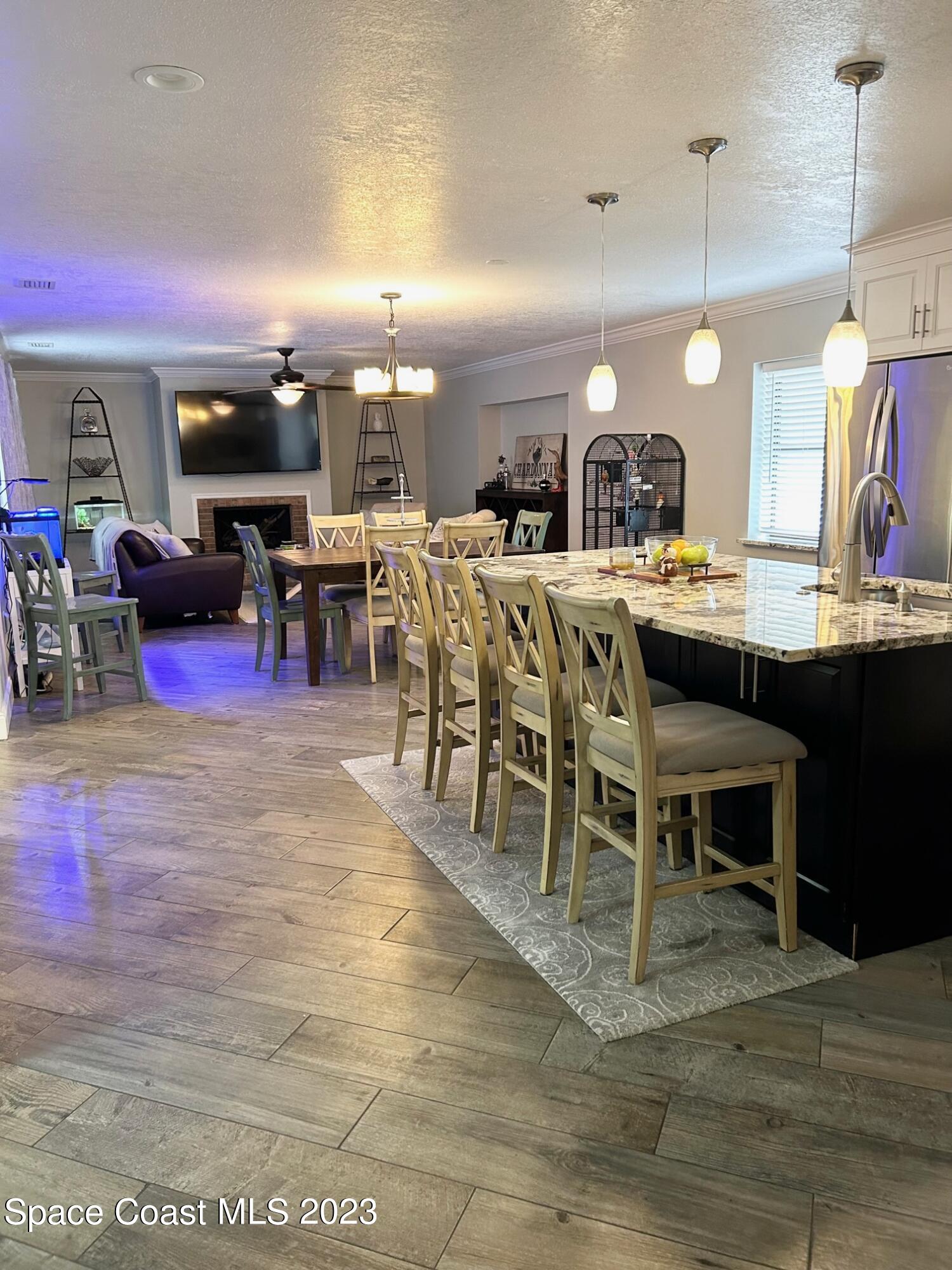 1639 Emmaus Road Northwest Palm Bay, FL 32907 - Photo 6 of 40 a view of a dining room with furniture