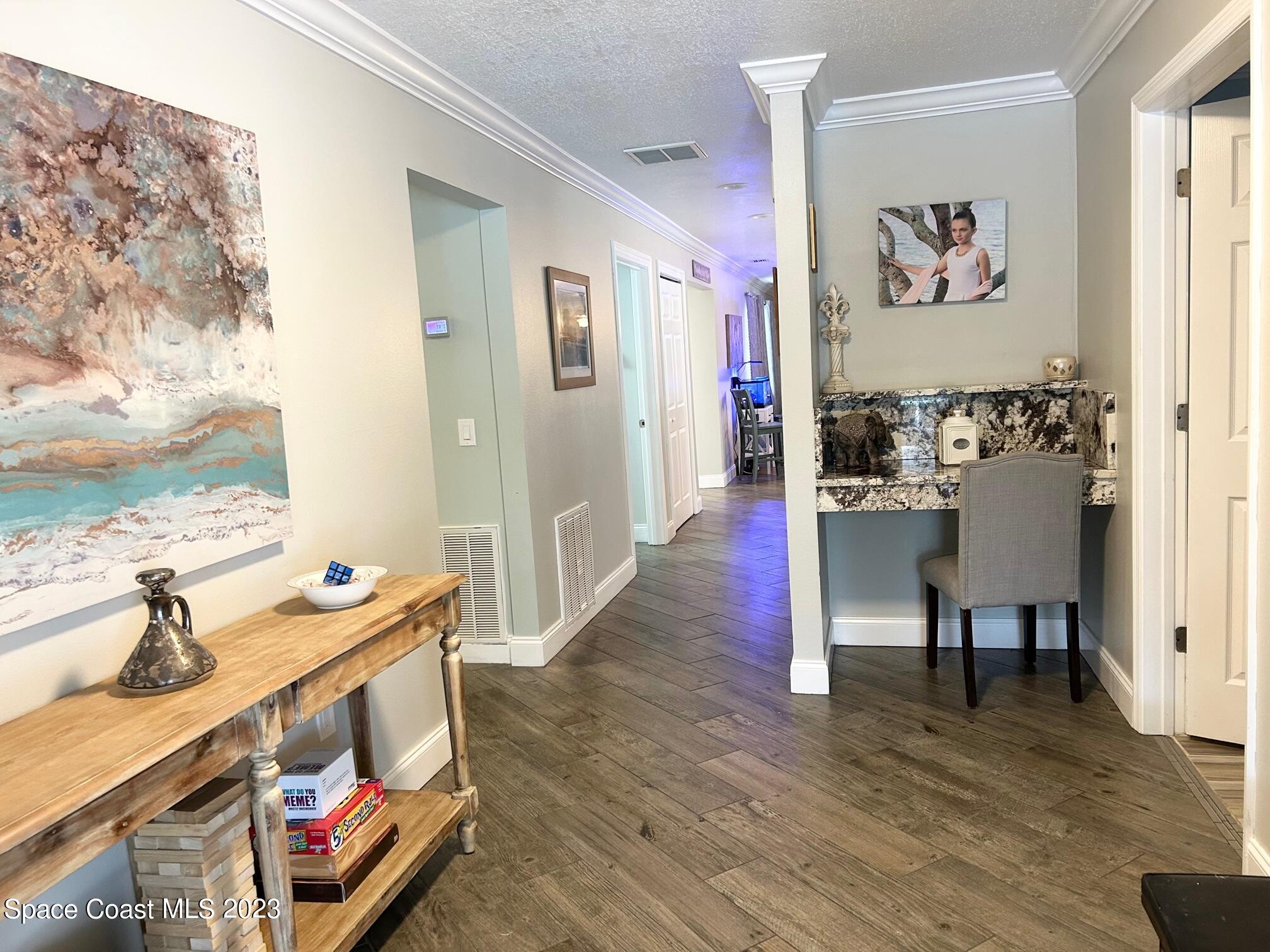 1639 Emmaus Road Northwest Palm Bay, FL 32907 - Photo 8 of 40 a living room with furniture and wooden floor