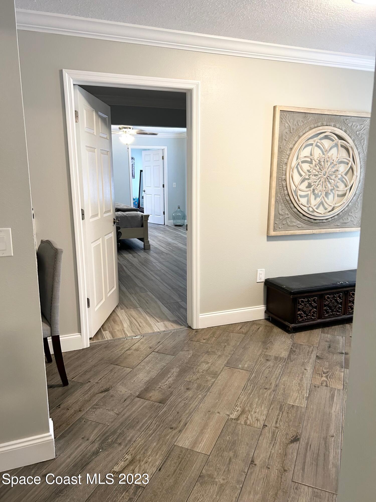 1639 Emmaus Road Northwest Palm Bay, FL 32907 - Photo 9 of 40 a view of a livingroom with furniture and a workspace