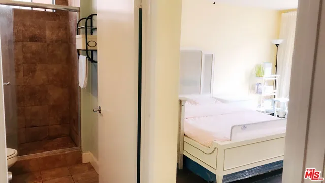 a bathroom with a bathtub and shower