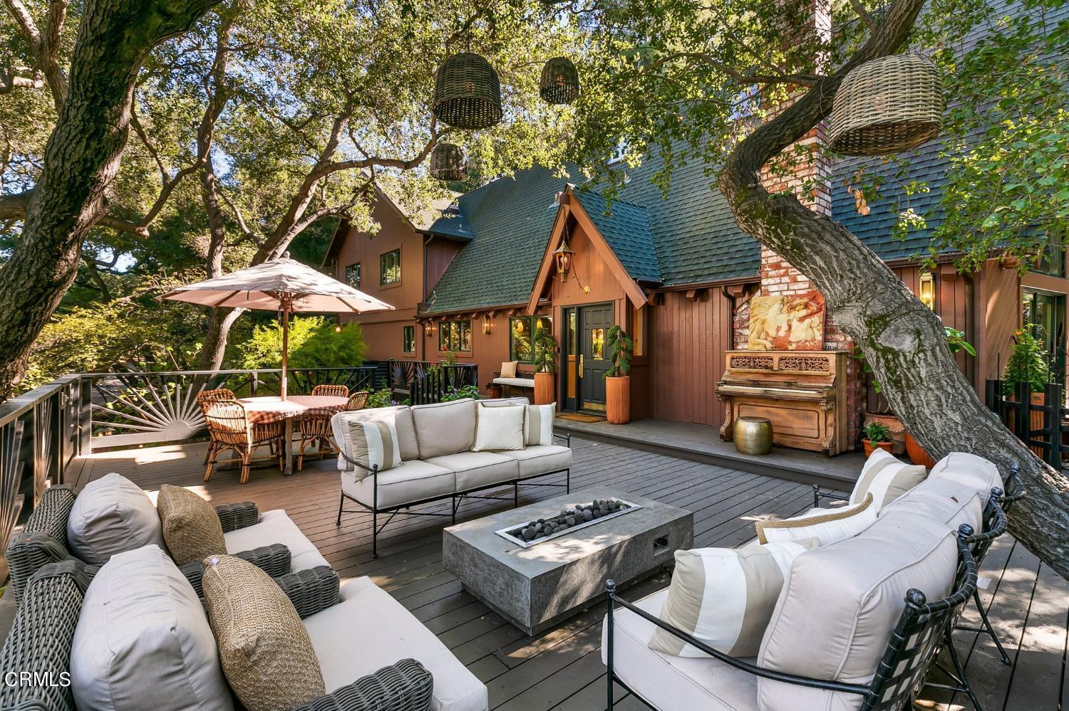 a backyard of a house with table and chairs
