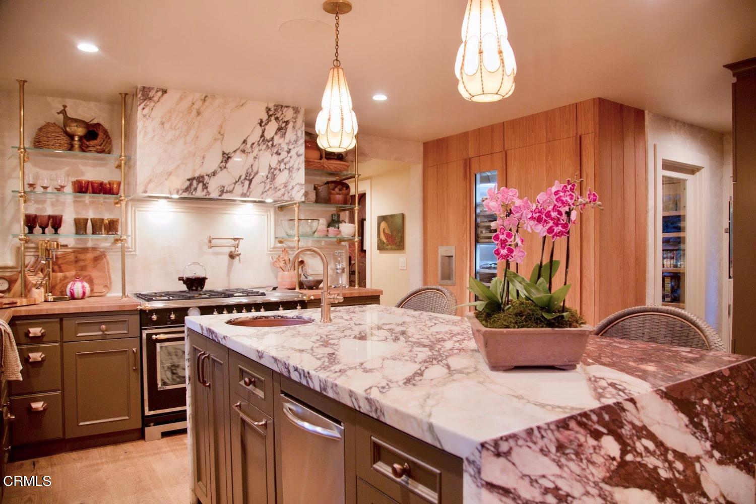 2460 Valley Meadow Drive Oak View, CA 93022 - Photo 12 of 49 a kitchen with stainless steel appliances granite countertop a sink a stove and a wooden floors
