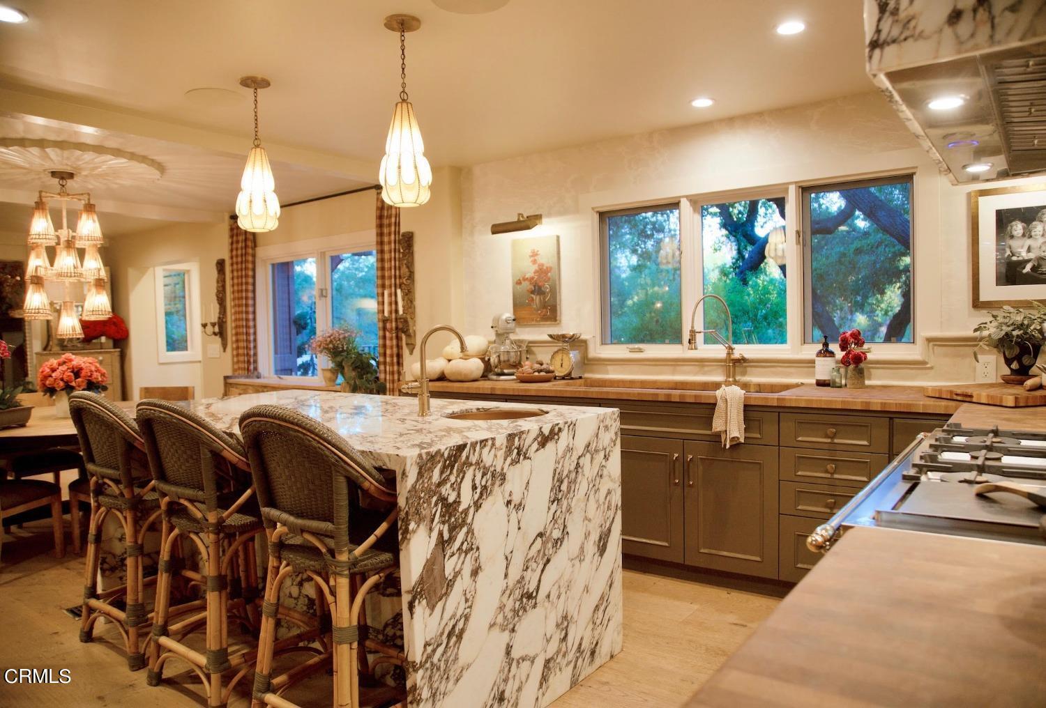 2460 Valley Meadow Drive Oak View, CA 93022 - Photo 14 of 49 a kitchen with stainless steel appliances a sink stove and a large window