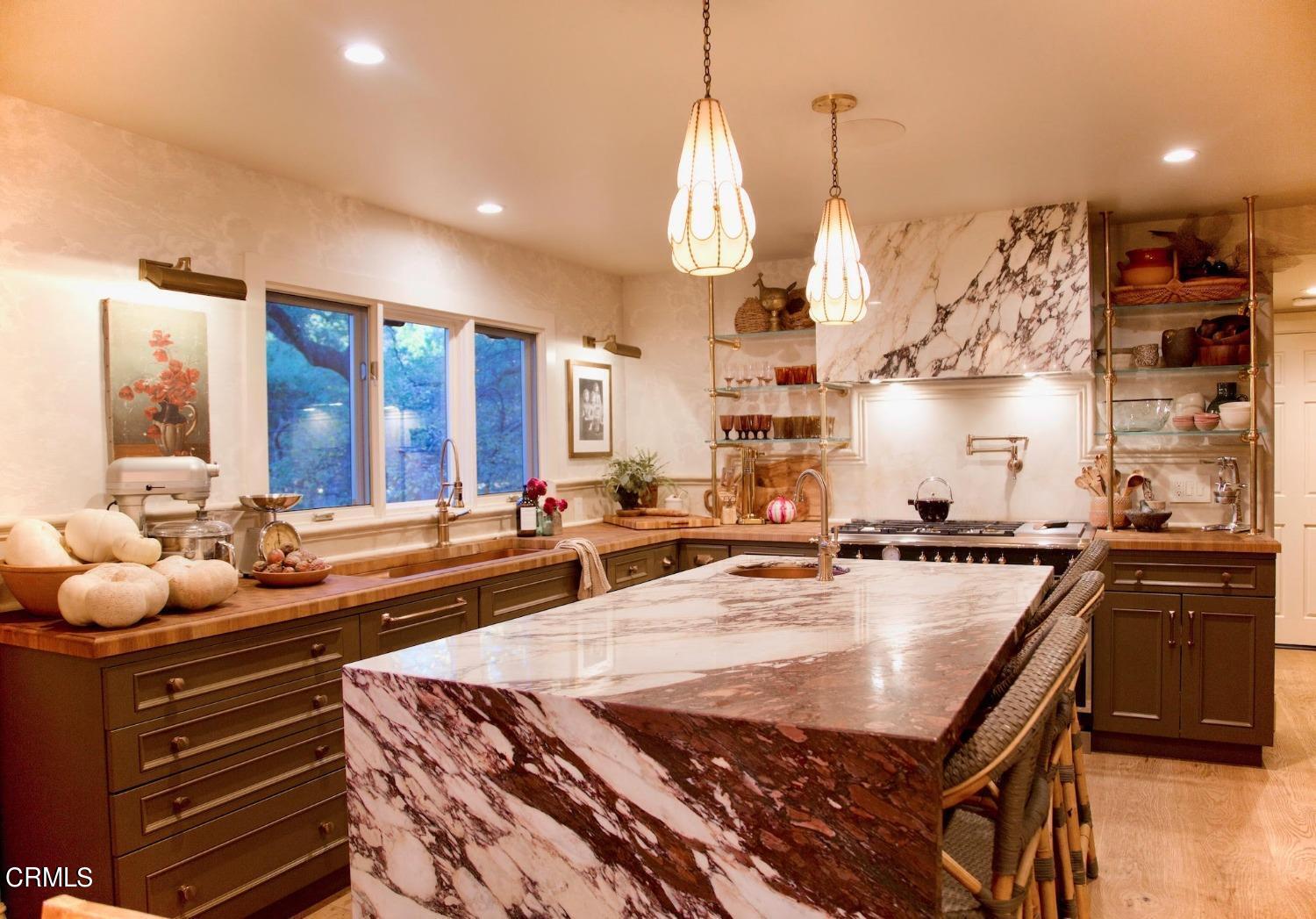 2460 Valley Meadow Drive Oak View, CA 93022 - Photo 15 of 49 a kitchen with counter space sink stove and cabinets