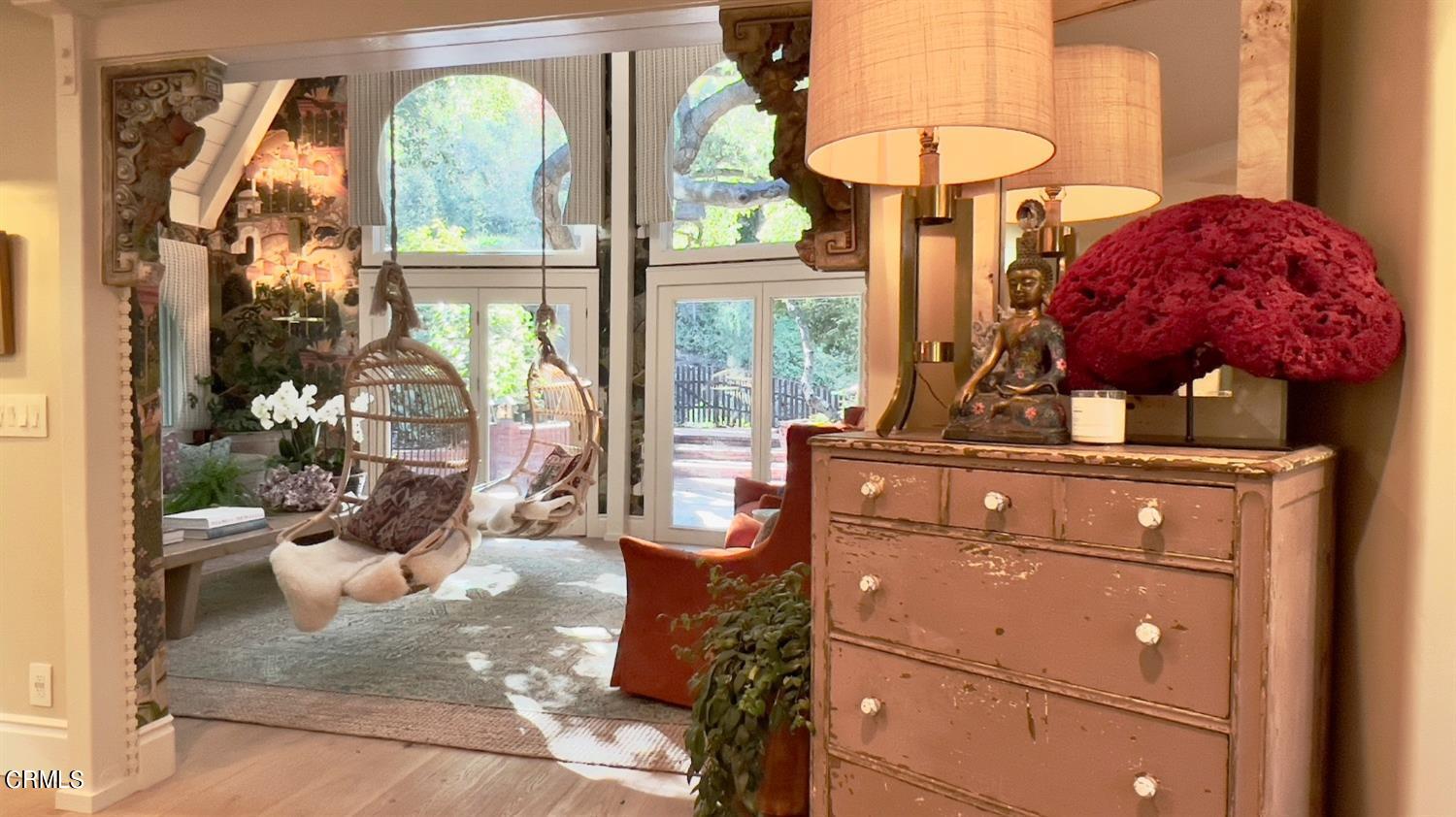 2460 Valley Meadow Drive Oak View, CA 93022 - Photo 16 of 49 a living room with a bed and a chandelier